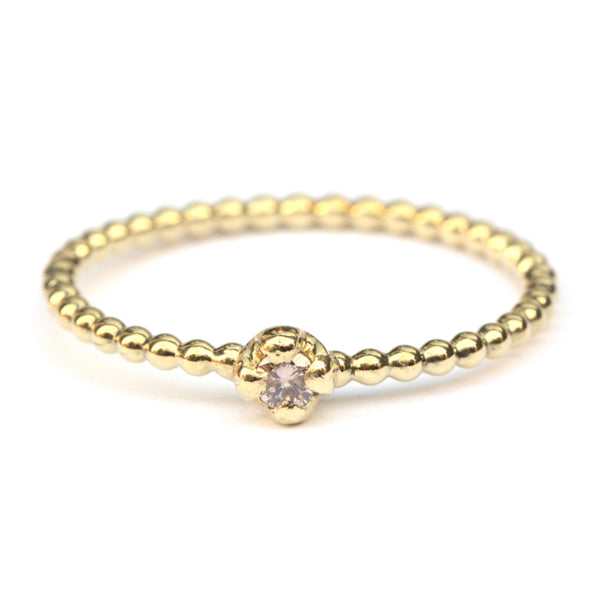 Parelring met pinkish brown diamant