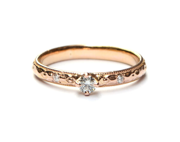 Verlovingsring van roodgoud met diamanten