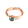 Rosegouden ring met blauwe diamant