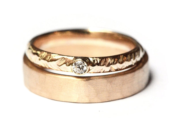Trouwringenset met veermotief en diamant
